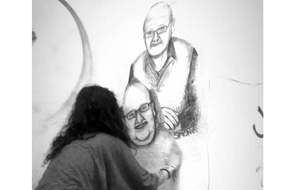 Lamezia, Street Art: ritratto di Antonio e Pino Saffioti sul muro adiacente la biblioteca comunale